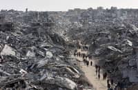 (FILES) This aerial view shows displaced Palestinians returning to the war-devastated Jabalia refugee camp in the northern Gaza Strip on January 19, 2025, shortly before a ceasefire deal in the war between Israel and the Palestinian militant group Hamas was implemented.