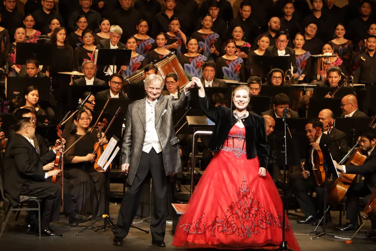 MAESTRO Grzegorz Nowak raises the hand of Soprano Katarzyna Dondalska.