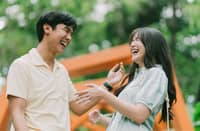 A COUPLE shares a light moment, highlighting the importance of present connection amid the rise of future-faking in dating.