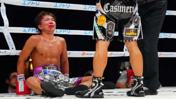 JOHNRIEL Casimero towers over the fallen Japanese Tom Mizokoshi in the fifth round of their featherweight fight on Saturday in Tokoname, Japan.