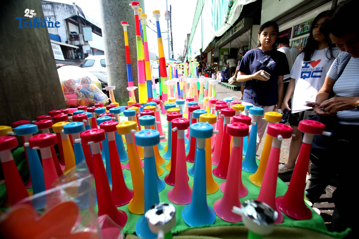 (December 30 2025) A vendor arrange and assist her customer buying party horn or Torotot a safe alternative noise makers for new year celebration, at Mega-Qmart in Quezon City. Photo/Analy Labor