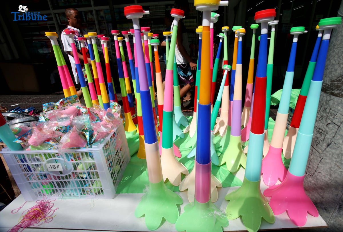 (December 30 2025) A vendor arrange and assist her customer buying party horn or Torotot a safe alternative noise makers for new year celebration, at Mega-Qmart in Quezon City. Photo/Analy Labor