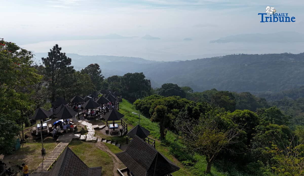 Local tourists enjoy the view of Taal Volcano as it is shrouded in smog at Picnic Grove, one of Tagaytay City’s popular tourist spots, ahead of New Year celebrations on December 30, 2025. Photo by Analy Labor