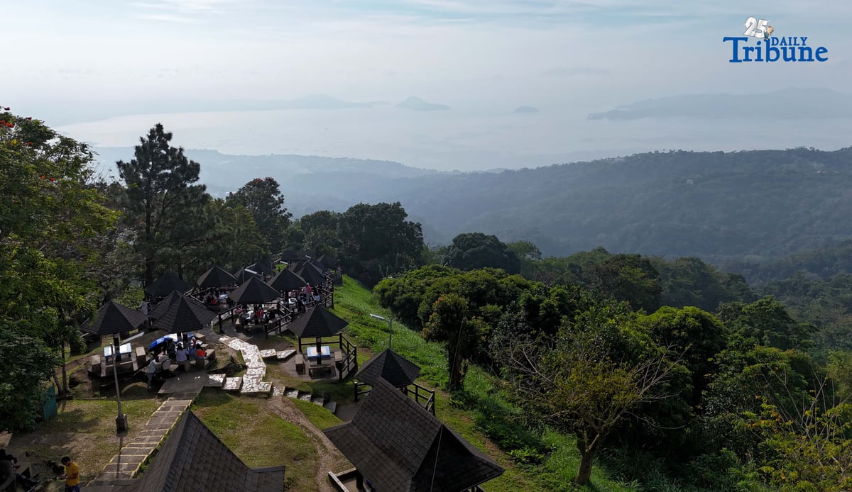 Local tourists enjoy the view of Taal Volcano as it is shrouded in smog at Picnic Grove, one of Tagaytay City’s popular tourist spots, ahead of New Year celebrations on December 30, 2025. Photo by Analy Labor