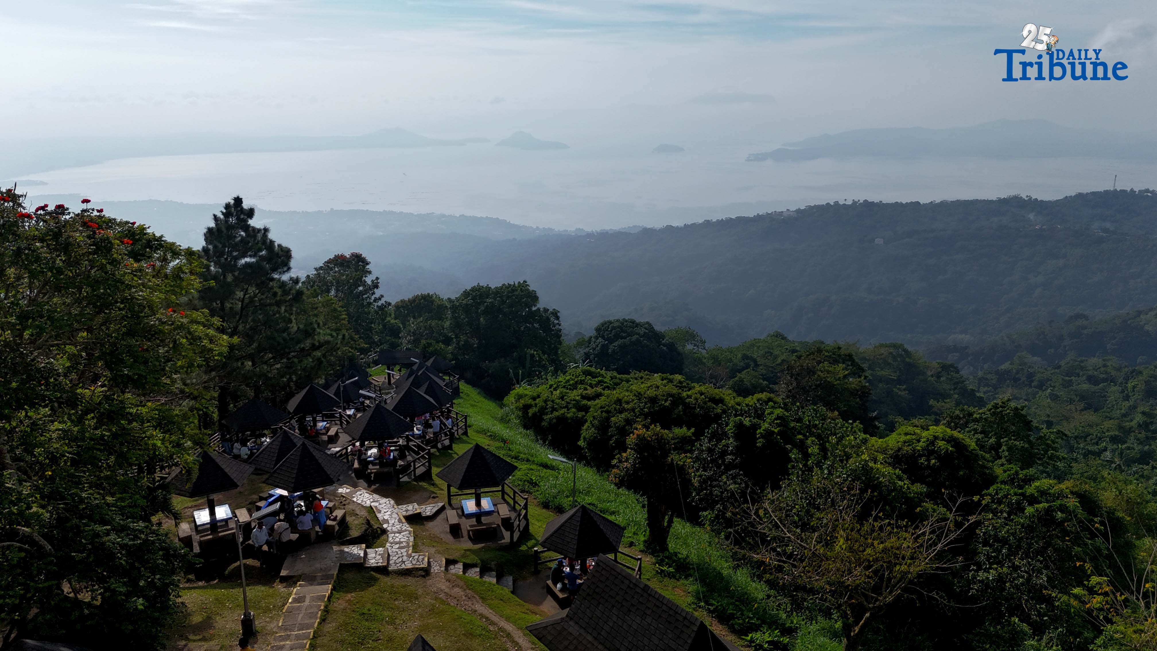 Local tourists enjoy the view of Taal Volcano as it is shrouded in smog at Picnic Grove, one of Tagaytay City’s popular tourist spots, ahead of New Year celebrations on December 30, 2025. Photo by Analy Labor