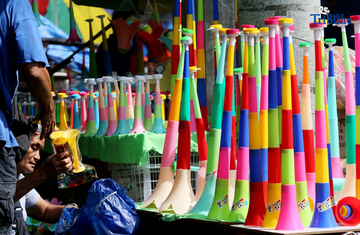 (December 30 2025) A vendor arrange and assist her customer buying party horn or Torotot a safe alternative noise makers for new year celebration, at Mega-Qmart in Quezon City. Photo/Analy Labor