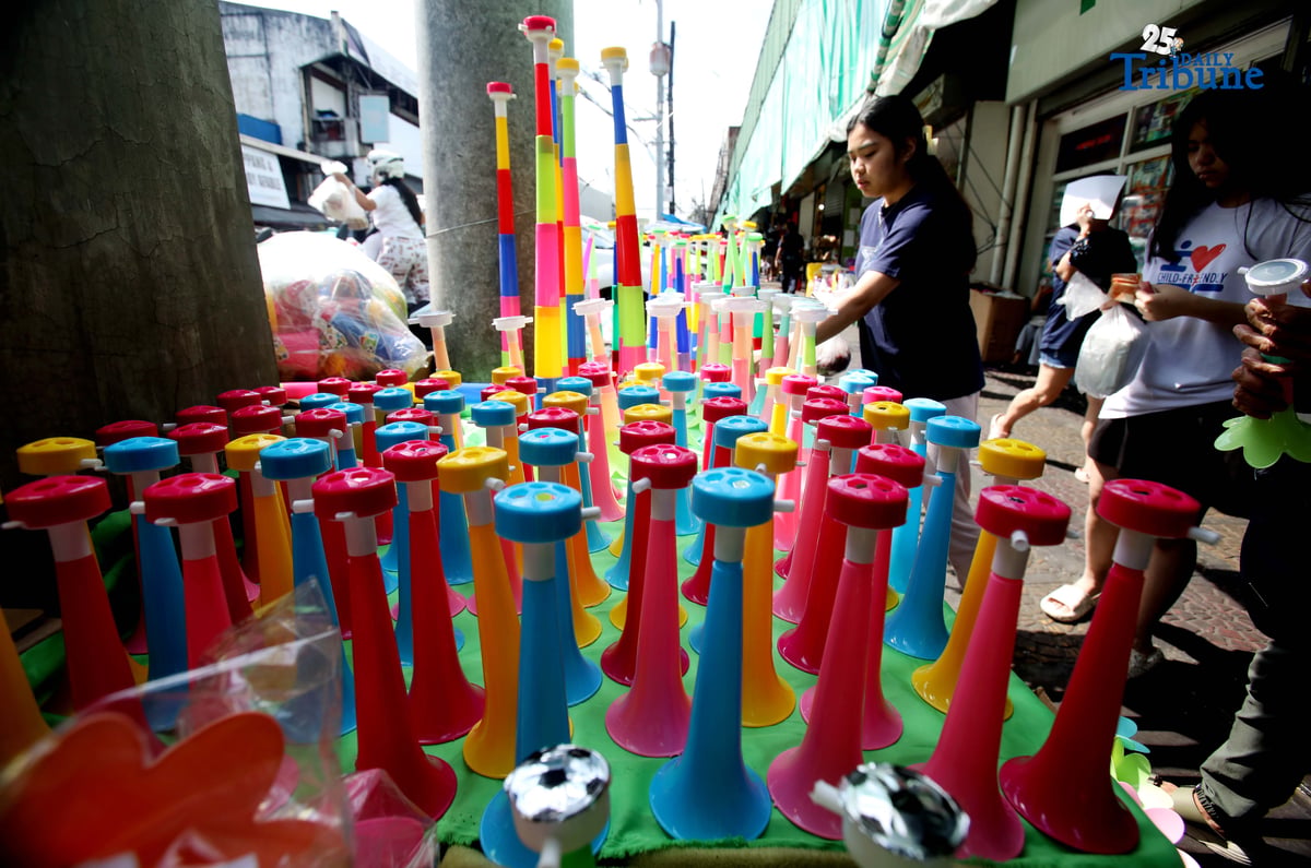 (December 30 2025) A vendor arrange and assist her customer buying party horn or Torotot a safe alternative noise makers for new year celebration, at Mega-Qmart in Quezon City. Photo/Analy Labor