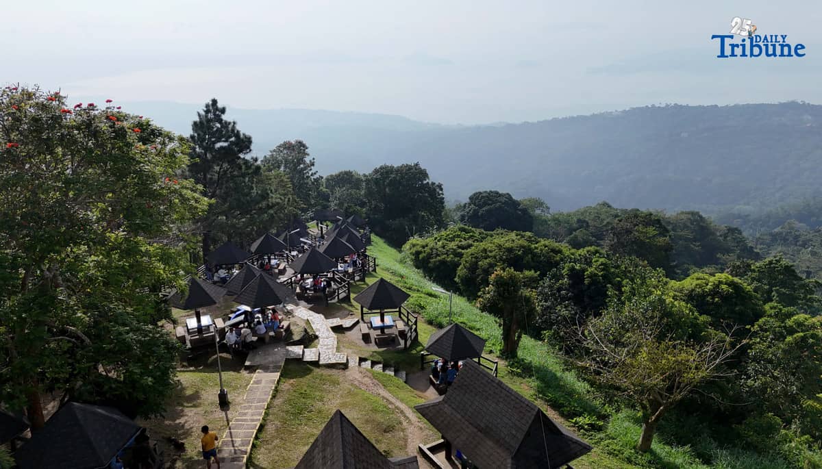 Local tourists enjoy the view of Taal Volcano as it is shrouded in smog at Picnic Grove, one of Tagaytay City’s popular tourist spots, ahead of New Year celebrations on December 30, 2025. Photo by Analy Labor