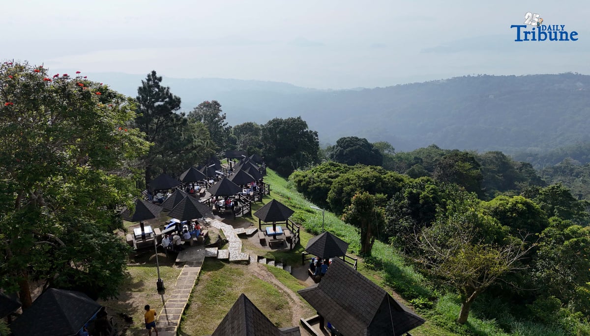 Local tourists enjoy the view of Taal Volcano as it is shrouded in smog at Picnic Grove, one of Tagaytay City’s popular tourist spots, ahead of New Year celebrations on December 30, 2025. Photo by Analy Labor
