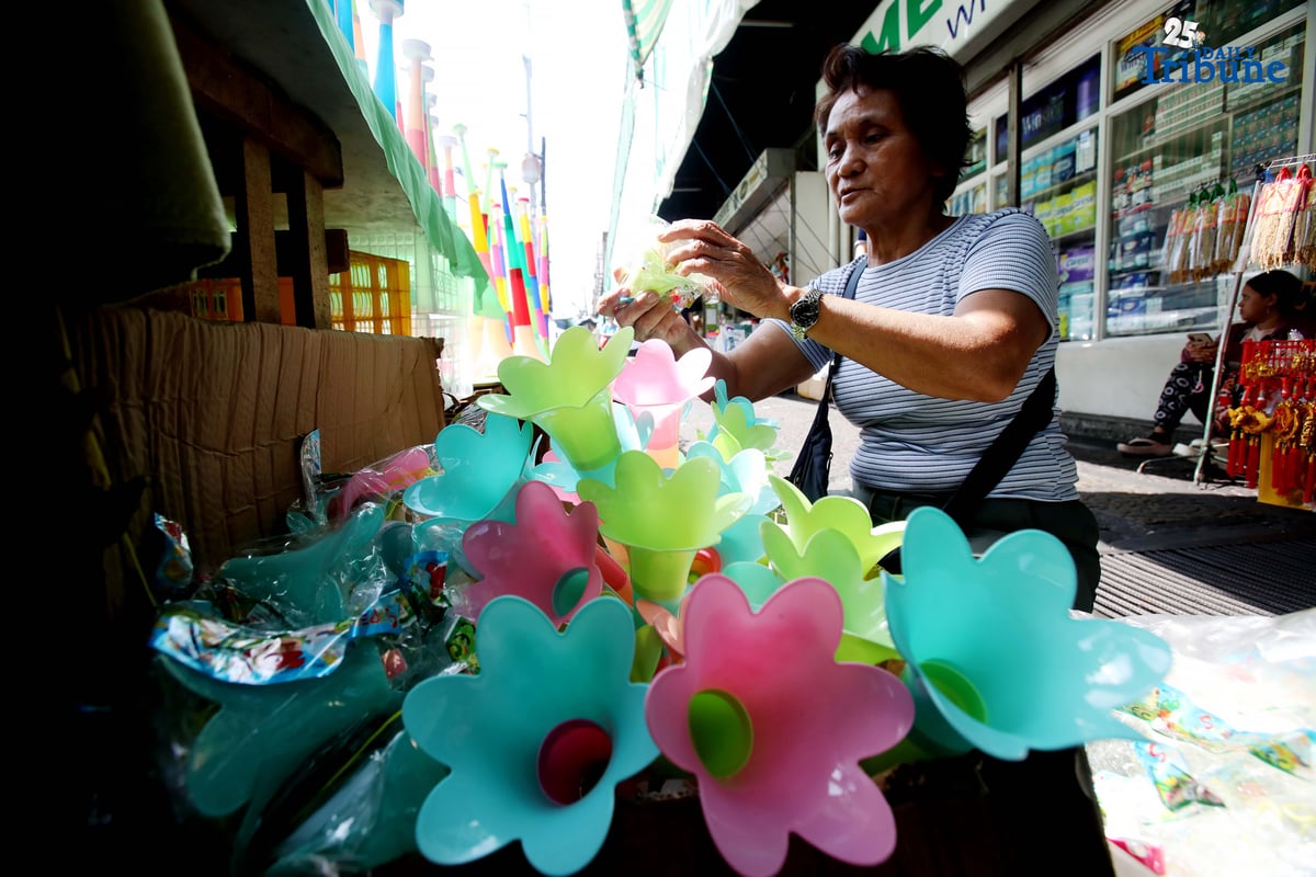 (December 30 2025) A vendor arrange and assist her customer buying party horn or Torotot a safe alternative noise makers for new year celebration, at Mega-Qmart in Quezon City. Photo/Analy Labor