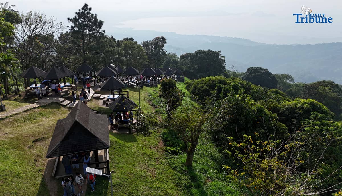 Local tourists enjoy the view of Taal Volcano as it is shrouded in smog at Picnic Grove, one of Tagaytay City’s popular tourist spots, ahead of New Year celebrations on December 30, 2025. Photo by Analy Labor