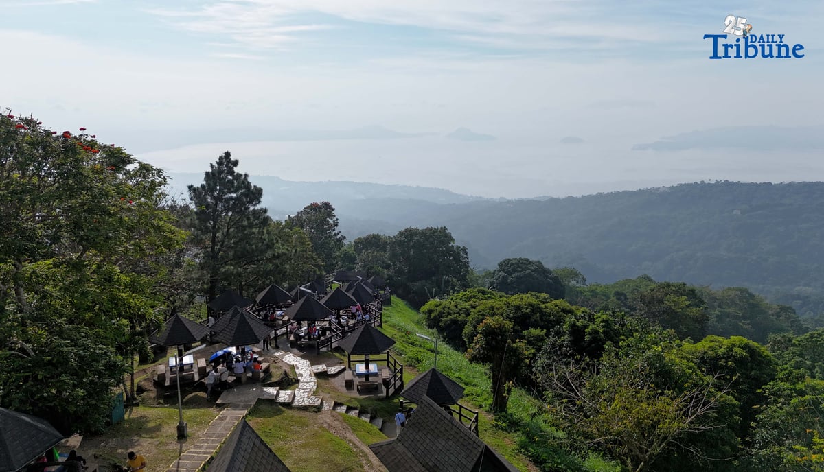 Local tourists enjoy the view of Taal Volcano as it is shrouded in smog at Picnic Grove, one of Tagaytay City’s popular tourist spots, ahead of New Year celebrations on December 30, 2025. Photo by Analy Labor