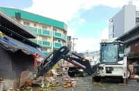 PERSONNEL from the Bacolod Environment and Natural Resources Office and the City Engineer’s Office lead a waste-hauling operation at Libertad South Market on Tuesday as the city prepares for a major transition in 2026, having tapped a Luzon-based consortium to manage garbage collection, hauling and sanitary landfill operations.