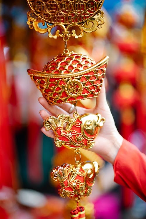 GOLDEN fish ornaments, symbols of wealth and abundance, add a sparkling touch to festive décor.