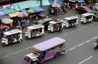 DESPITE the ban on electric bikes and electric trikes imposed by the Land Transportation Office, an e-trike is seen picking up passengers along Commonwealth Avenue in Quezon City on Friday. The LTO announced that it is starting to apprehend violators to improve road safety and traffic flow on major thoroughfares.