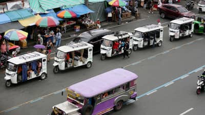 DESPITE the ban on electric bikes and electric trikes imposed by the Land Transportation Office, an e-trike is seen picking up passengers along Commonwealth Avenue in Quezon City on Friday. The LTO announced that it is starting to apprehend violators to improve road safety and traffic flow on major thoroughfares.