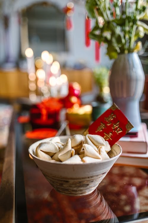 A BOWL of fortune cookies, symbolizing luck and positive wishes, sits ready for celebration.