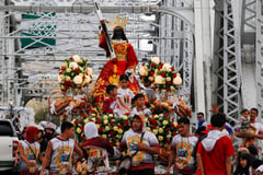 Devotees prepare for the blessings of replica of Jesus Nazareno 