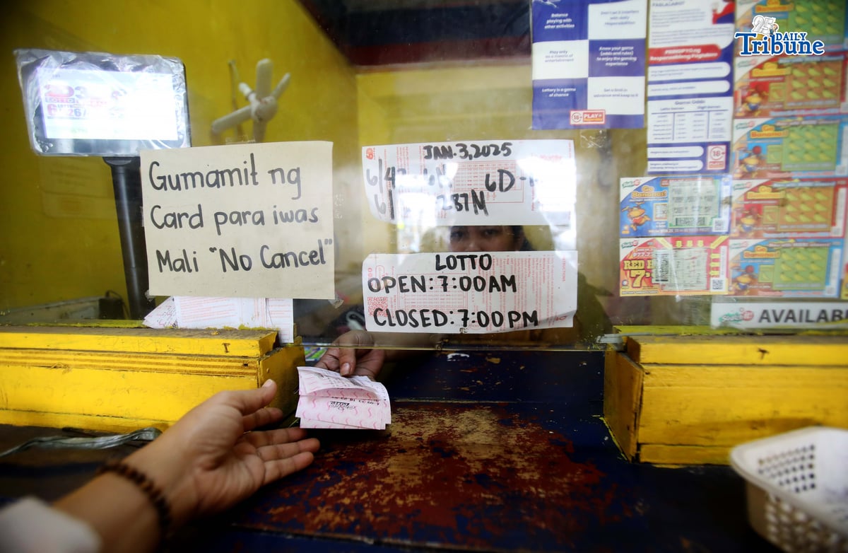 (January 03 2026) A lotto patron places his bet at a local PCSO lotto outlet in Quezon City hoping to win the Grand Lotto 6/55 jackpot which is expected to reach P280+ million on Saturday, January 3, 2026. Photo/Analy Labor