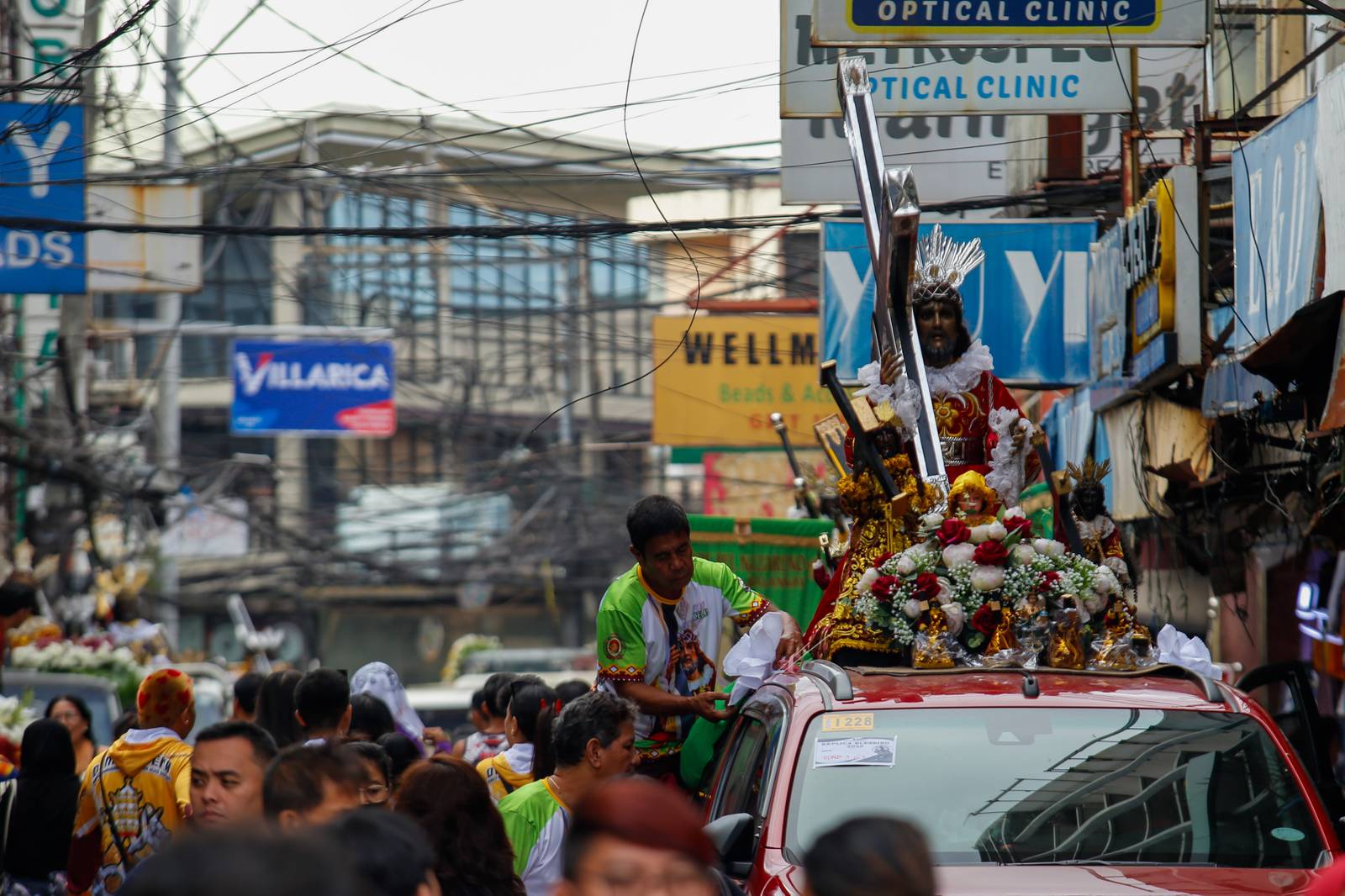 Catholic devotees start lining up with their replica of Jesus Nazareno along designated streets in Quiapo, Manila, on the morning of 03 January 2025. The blessing of the replica, which will take place in the afternoon, is expected to draw thousands of devotees.