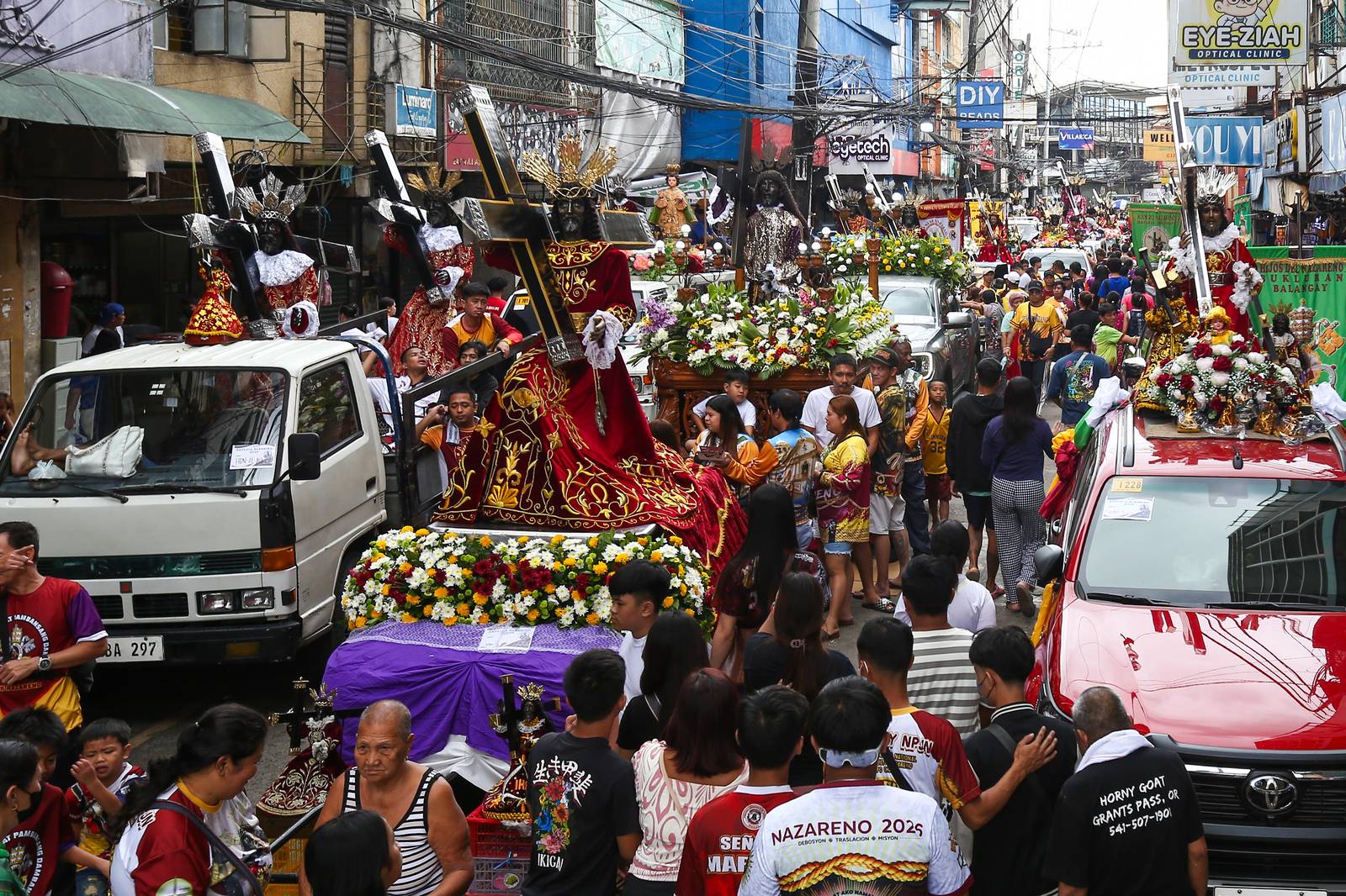 Catholic devotees start lining up with their replica of Jesus Nazareno along designated streets in Quiapo, Manila, on the morning of 03 January 2025. The blessing of the replica, which will take place in the afternoon, is expected to draw thousands of devotees.