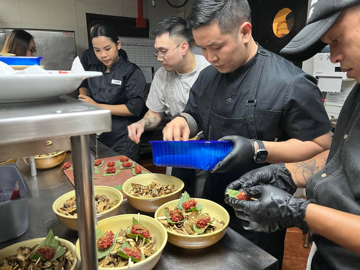 CHEF Jorge Mendez preparing his menu for the Tastemakers dinner at Balesin Island.