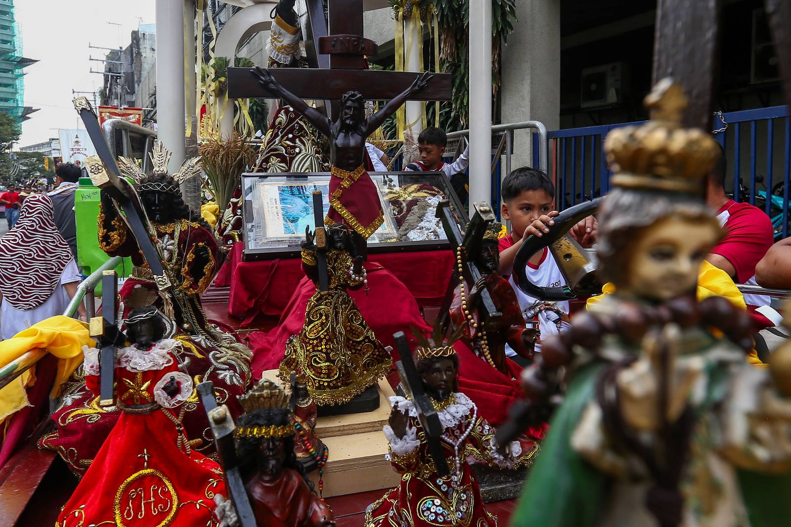 Catholic devotees start lining up with their replica of Jesus Nazareno along designated streets in Quiapo, Manila, on the morning of 03 January 2025. The blessing of the replica, which will take place in the afternoon, is expected to draw thousands of devotees.