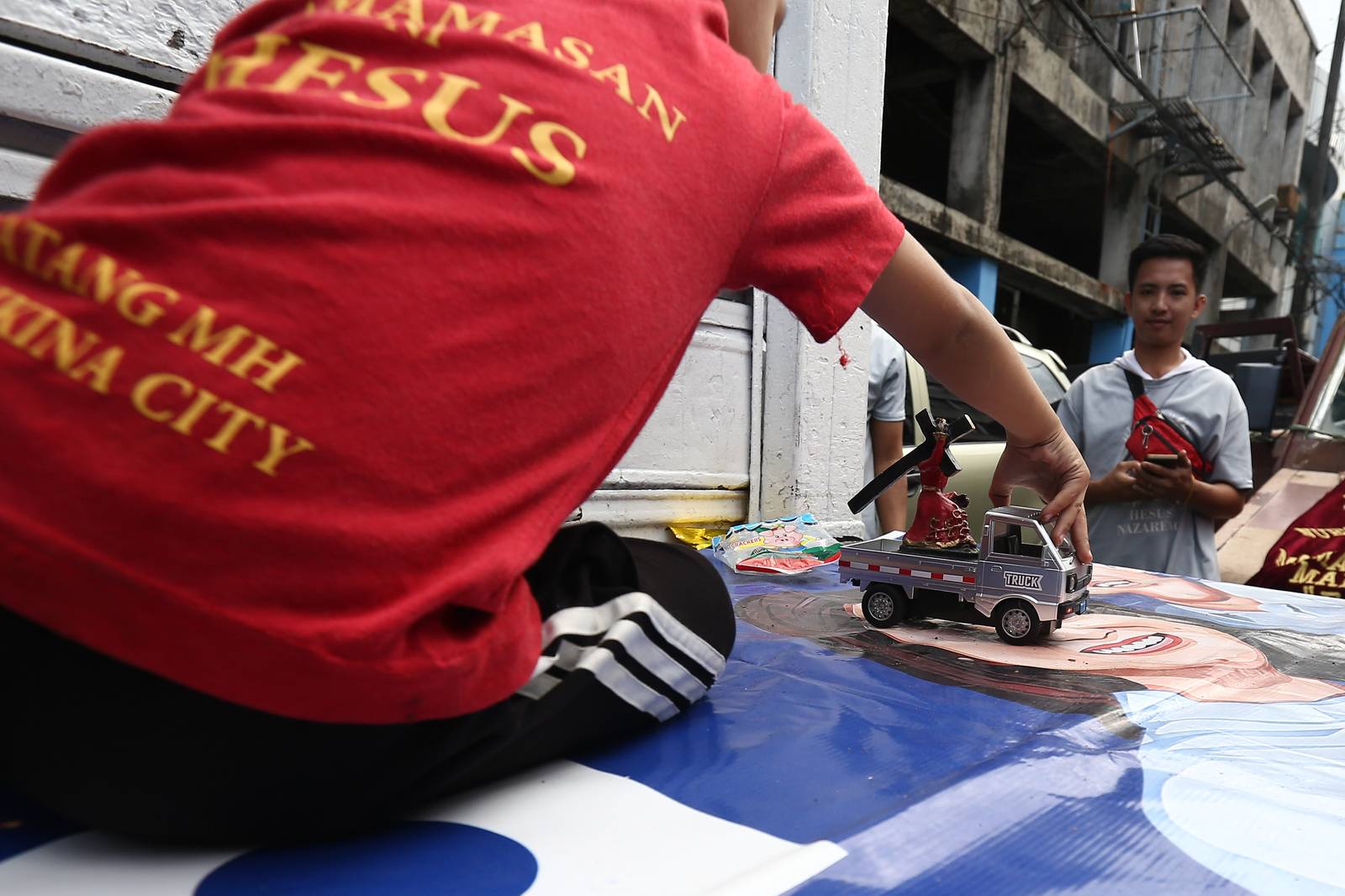 Catholic devotees start lining up with their replica of Jesus Nazareno along designated streets in Quiapo, Manila, on the morning of 03 January 2025. The blessing of the replica, which will take place in the afternoon, is expected to draw thousands of devotees.