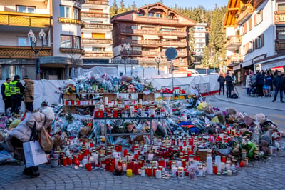 Raw emotion as mourners pay tribute to Swiss fire victims