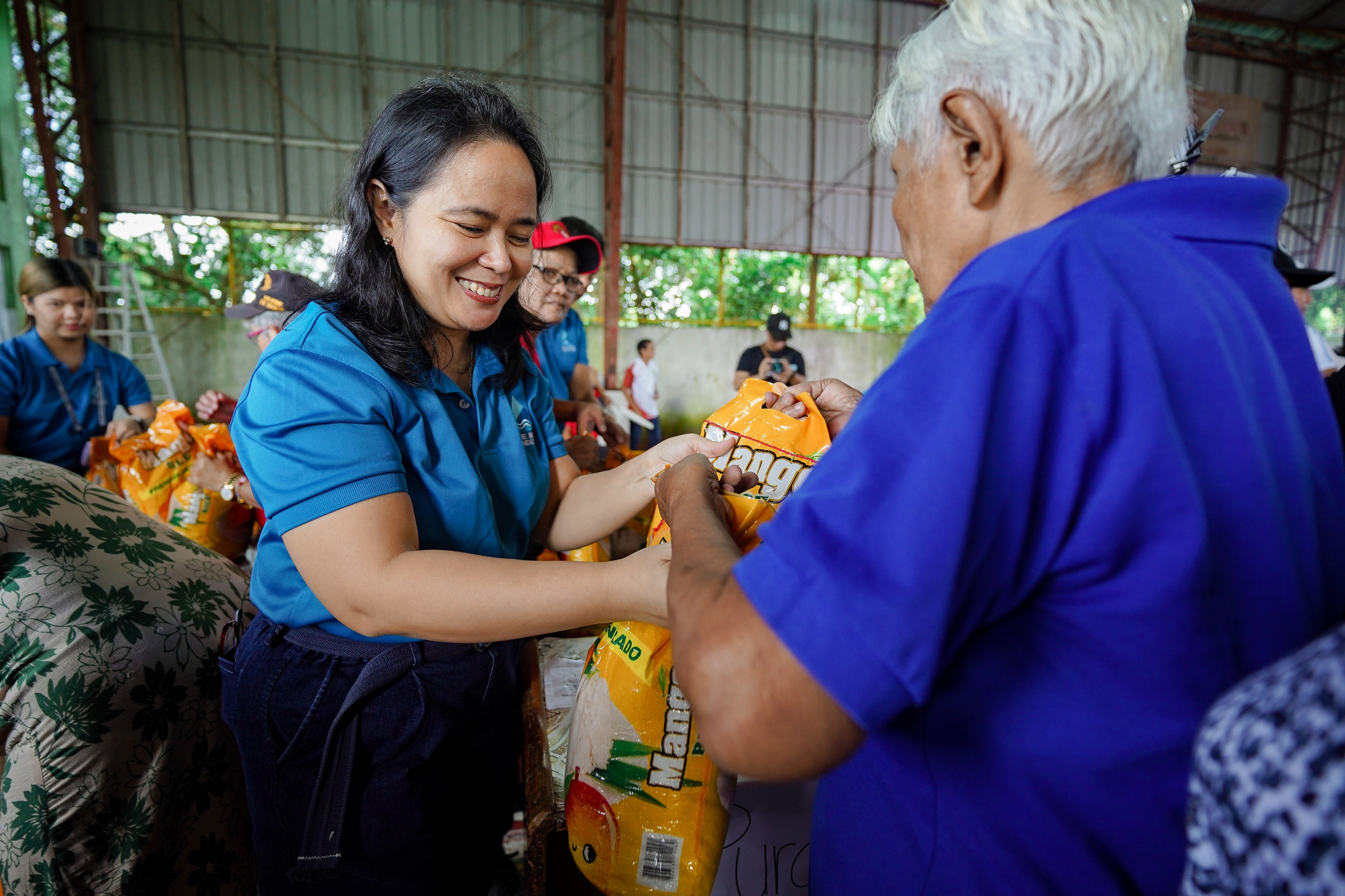 A SENIOR citizen receives a rice pack from Prime Infra Foundation and its partners.
