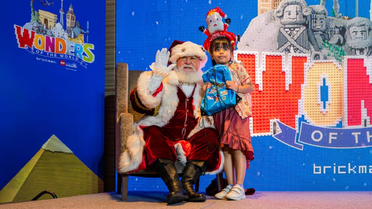 Beneficiaries of the Gift of Life Program creating their own LEGO mosaic and having a close encounter with Santa Claus