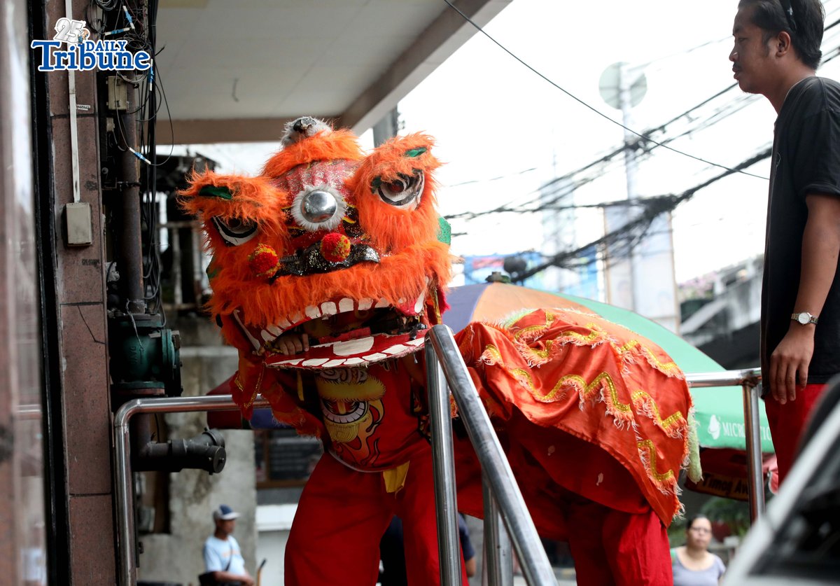 Lion dancers perform at a store in Quezon City.
Lion dance is a traditional Chinese performance believed to bring good fortune and wealth.