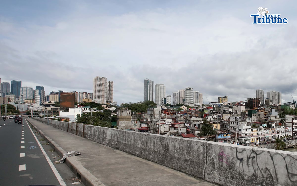 ECONOMIC OUTLOOK
Buildings tower over a low-rise residential area in Pasig City. The United Nations said that as the country rebounds from a corruption scandal, the Philippine economy may expand at a faster pace this year and in 2027, supported by household consumption and easing inflation. In its latest World Economic Situation and Prospects report, the UN projected Philippine gross domestic product growth at 5.7 percent this year and 6.1 percent in 2027.