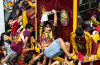 A crowd estimate by late afternoon Friday of over 600,000 Catholic devotees is seen to have filled the streets of Manila for the procession of the carriage or andas carrying the image of the Black Nazarene during the annual religious procession or Traslacion on 9 January.