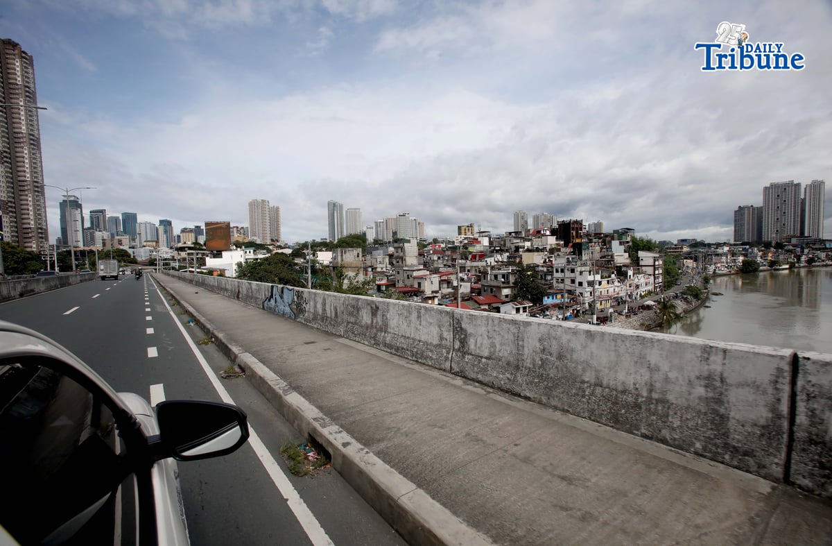 ECONOMIC OUTLOOK
Buildings tower over a low-rise residential area in Pasig City. The United Nations said that as the country rebounds from a corruption scandal, the Philippine economy may expand at a faster pace this year and in 2027, supported by household consumption and easing inflation. In its latest World Economic Situation and Prospects report, the UN projected Philippine gross domestic product growth at 5.7 percent this year and 6.1 percent in 2027.