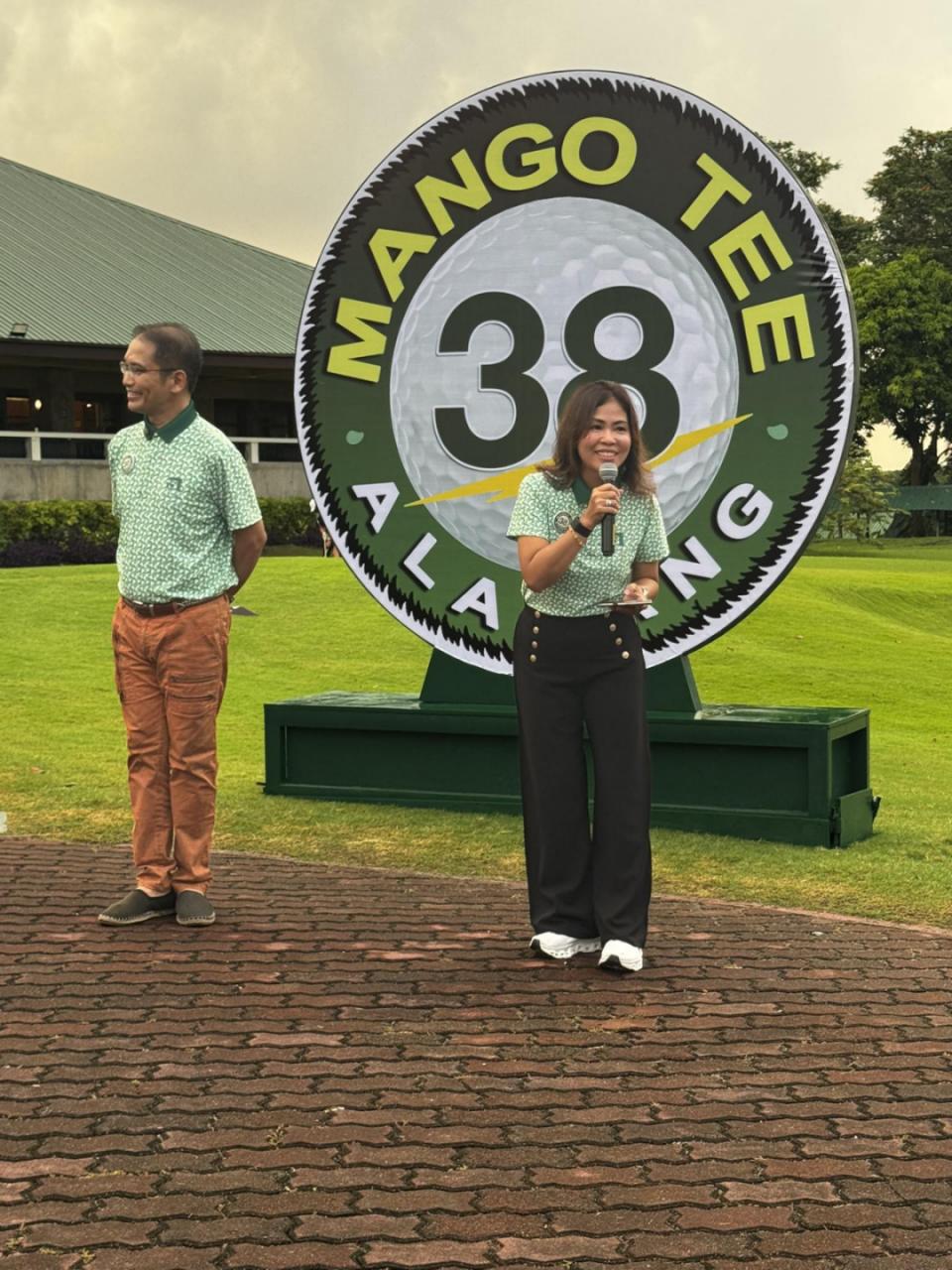 SARAH MEDINA, shown here with Randy Nonato, is the first woman to chair the Mango Tee organizing committee.
