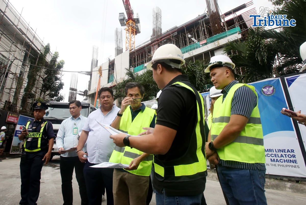 Department of Public Works and Highways (DPWH) Secretary Vince Dizon inspects the ongoing construction of Philippine Cancer Center 20-storey hospital building, in Quezon City, on Tuesday, 13 January 2026