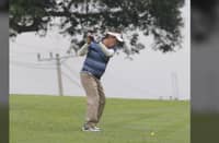 DAILY TRIBUNE President Willie Fernandez eyes on the ball while making his approach at Orchard Golf & Country Club in Dasmariñas, Cavite. He fired a net even par 72 to finish fourth in Class B.