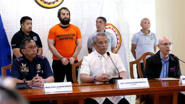 (FILE) DEPARTMENT of the Interior and Local Government Secretary Jonvic Remulla (center) on Thursday speaks to the media following his announcement that Russian vlogger Vitaly Zdorovetskiy will be deported.
