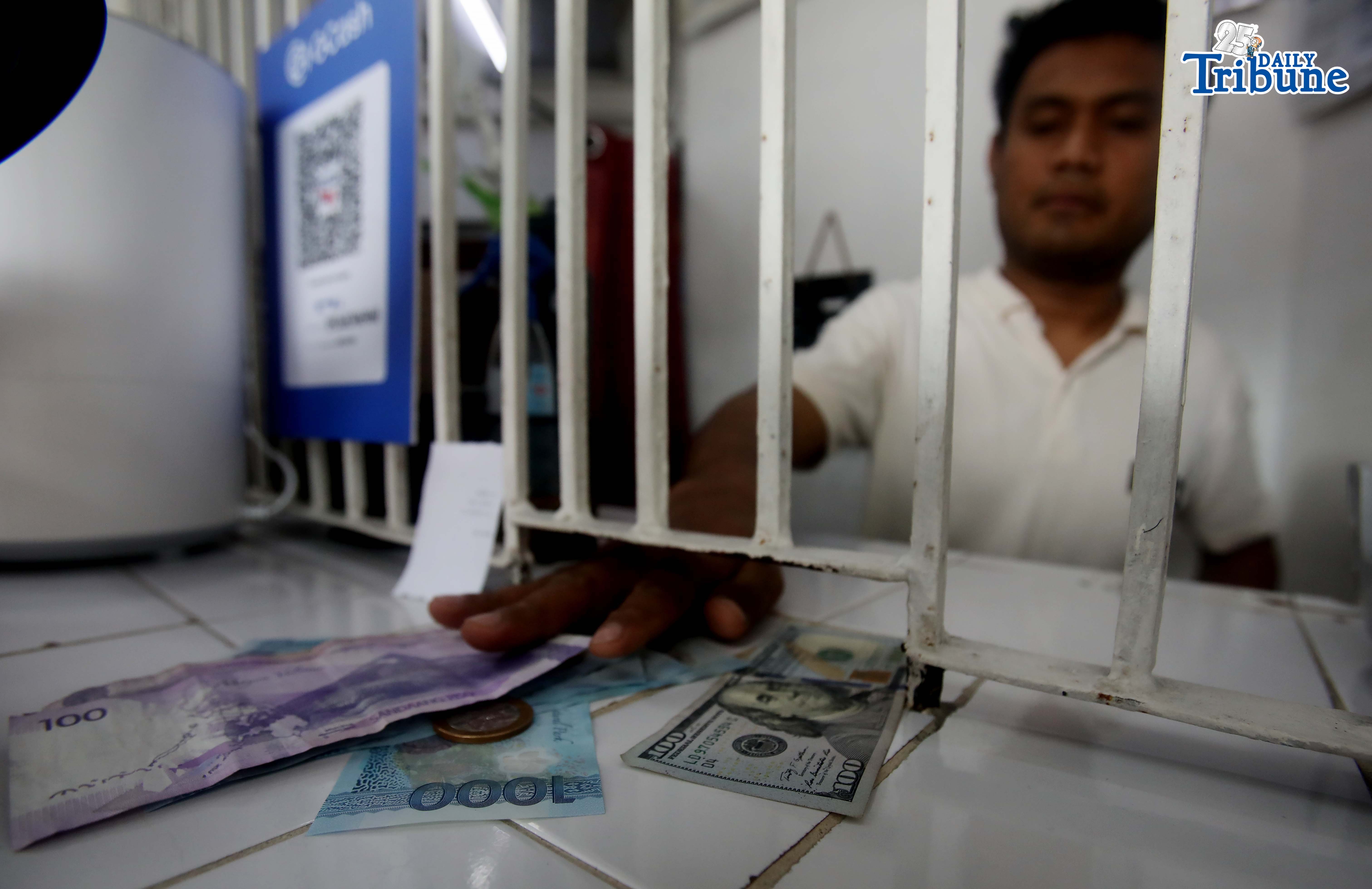 Philippine peso hits record low past P60