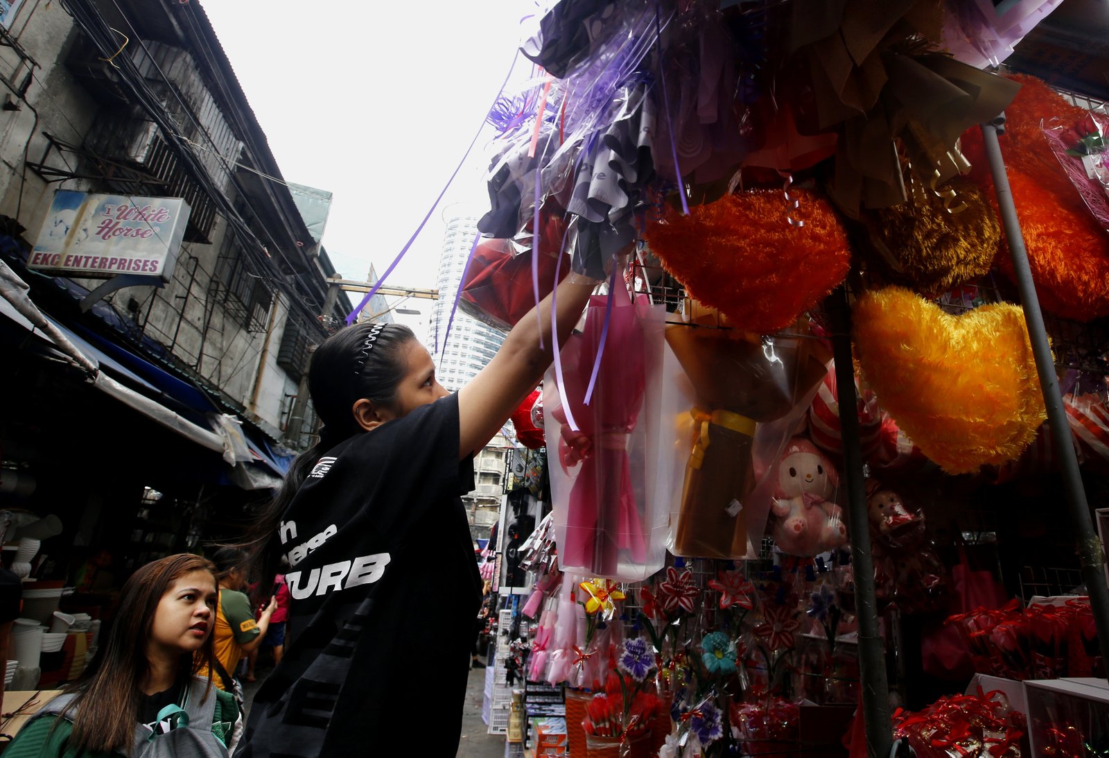 Valentine's Day is in the air for sidewalk vendors in Divisoria, Manila, on 15 January 2025, as they start selling plastic flowers, cards, plushies, gift items, and other novelty products. Gift items can go as low as 10 pesos and as high as 350 pesos.