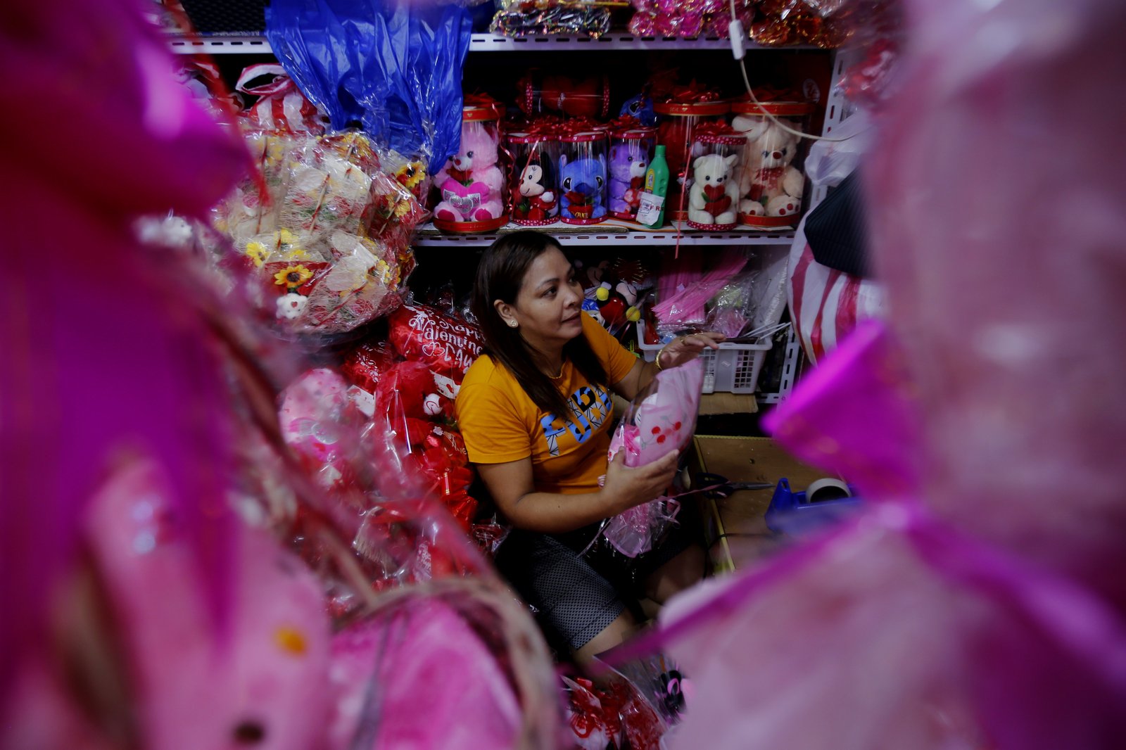 Valentine's Day is in the air for sidewalk vendors in Divisoria, Manila, on 15 January 2025, as they start selling plastic flowers, cards, plushies, gift items, and other novelty products. Gift items can go as low as 10 pesos and as high as 350 pesos.