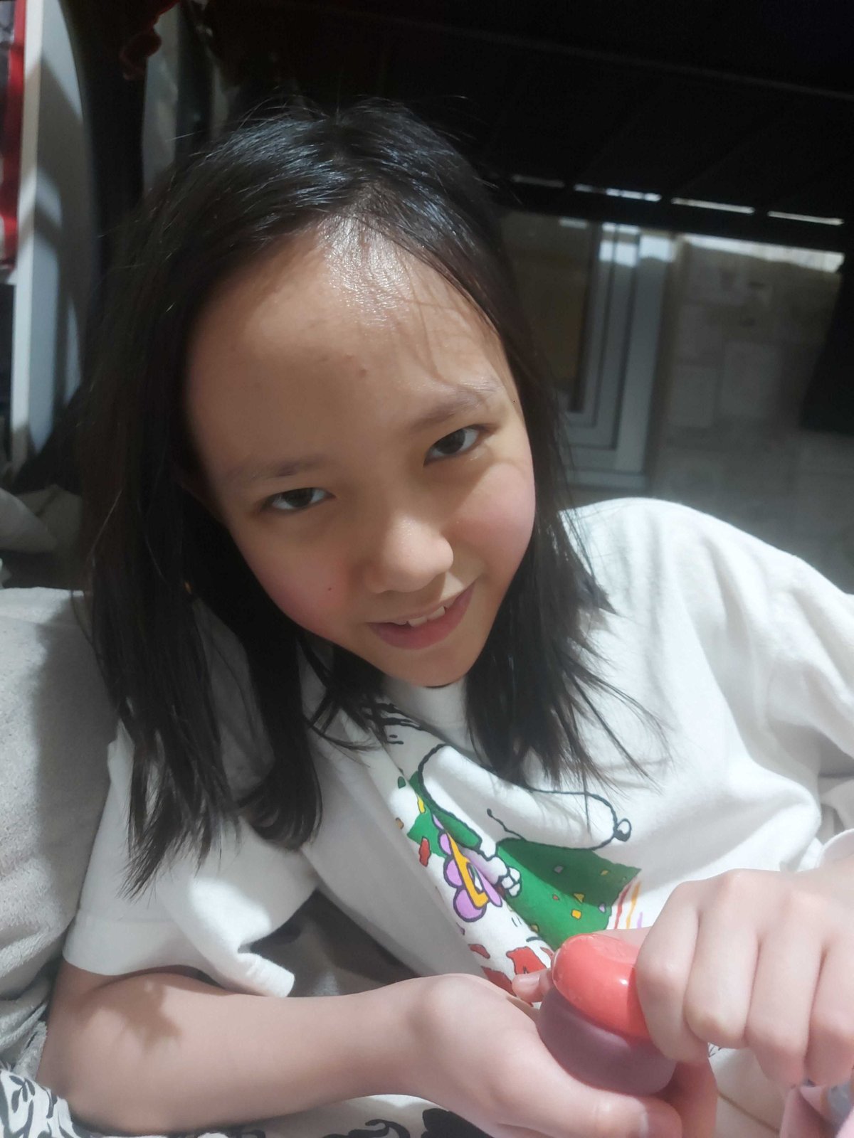 A PRE-TEEN wearing blush from the Fwee multi-pot