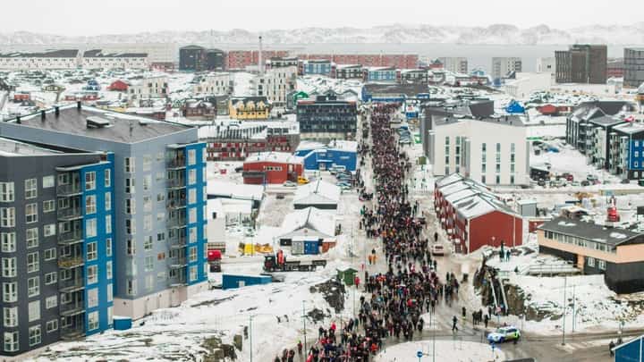 PEOPLE take part in a demonstration that gathered almost a third of the city's population to protest against the US president’s plans to take Greenland, in Nuuk on 17 January 2026.