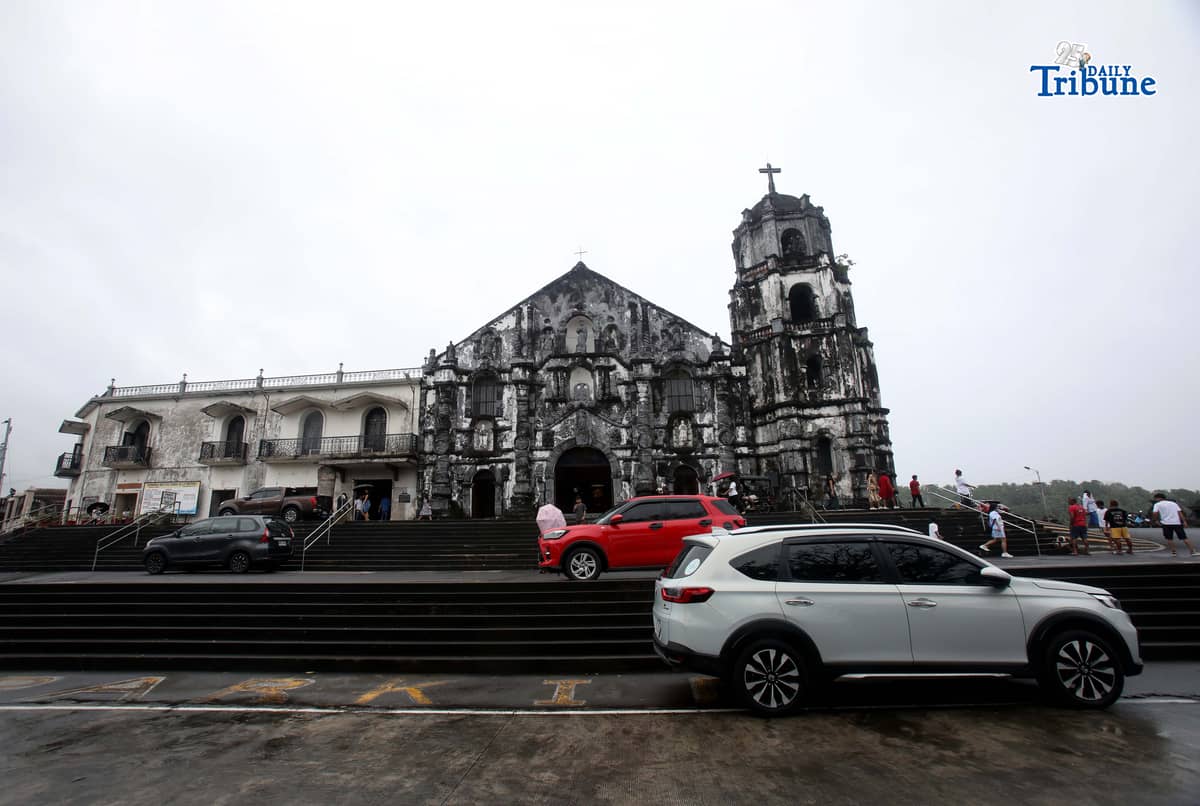 Local tourists attended mass and took selfies at the 18th-century Church of Nuestra Señora de la Porteria (Our Lady of the Gate, commonly known as Daraga Church), overlooking the sea and the majestic Mayon Volcano, on Sunday, 18 January 2026.
