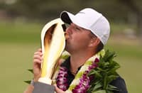 CHRIS Gotterup lifts the trophy after his season-opening victory in the Sony Open at the Waialae Country Club in Hawaii on Sunday.