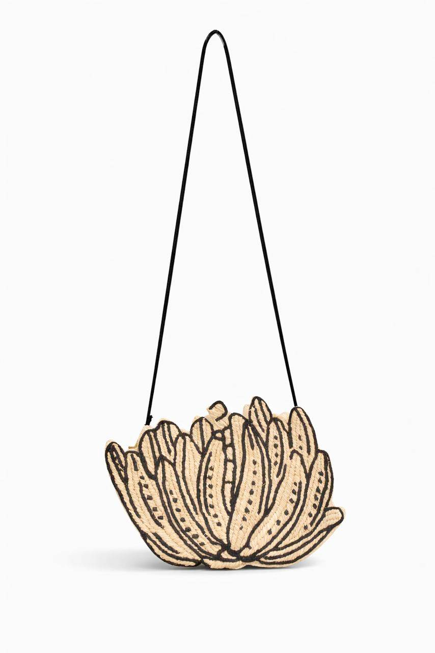 ARANAZ Spring Summer 2026 consists of The Kubo Clutch series: Saba, Orkidia, Dahon clutches. They are all hand embroidered raffia on tinalak showcasing illustrated “sketches” in organic silhouettes. Available in three variants.  Approximately 8 x 5 inches in size it can be worn handheld or over the shoulder with a detachable leather strap.