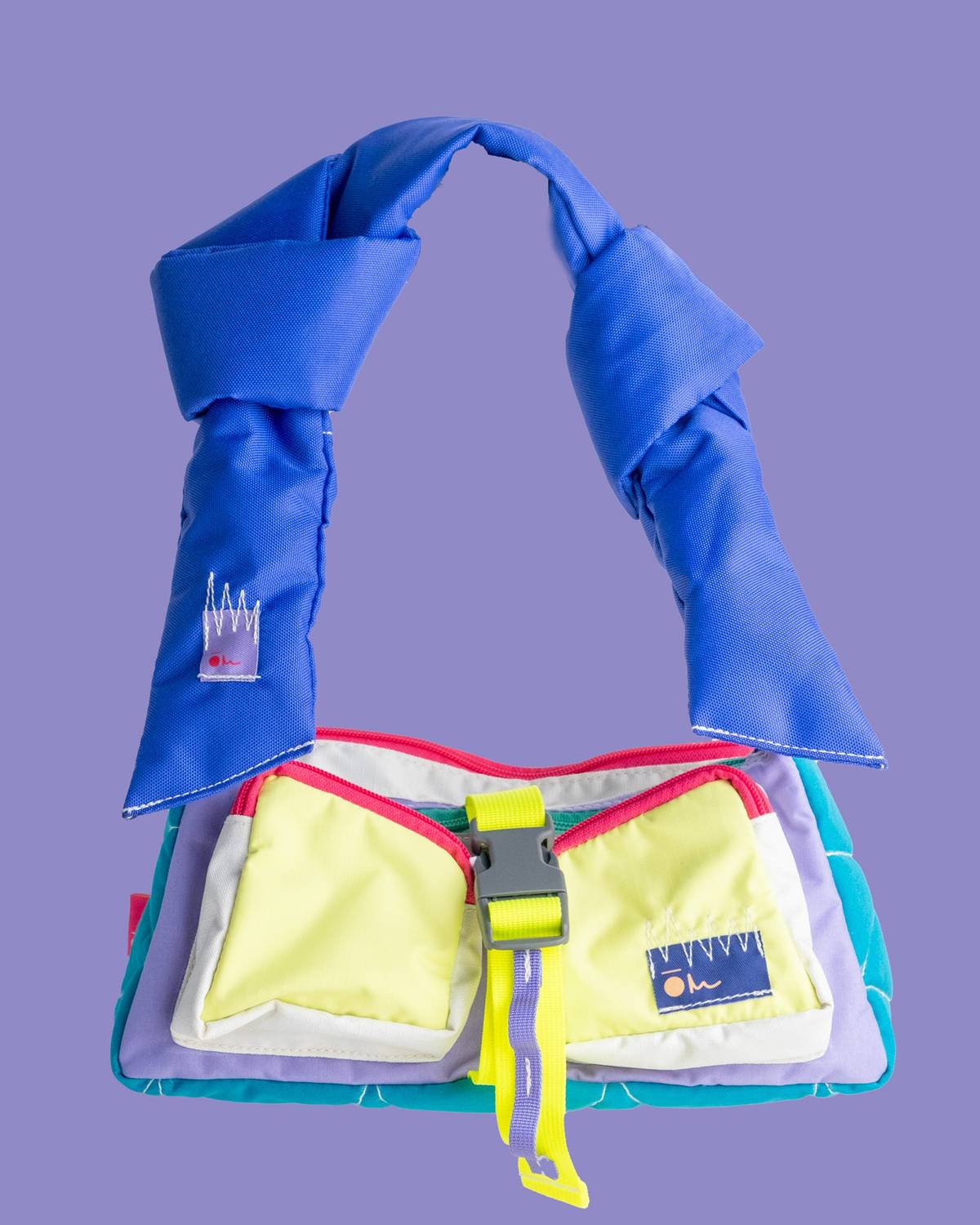 THE Gopi bag by Carry On is the brand’s most versatile bag defined by its signature padded strap. Shaped in a soft half-moon silhouette, it features a padded main compartment, a concealed back pocket sized for a large smartphone and travel essentials, and two front utility pockets. Crafted from rescued nylon materials, it carries approximately 3.5 liters while remaining compact on the body.