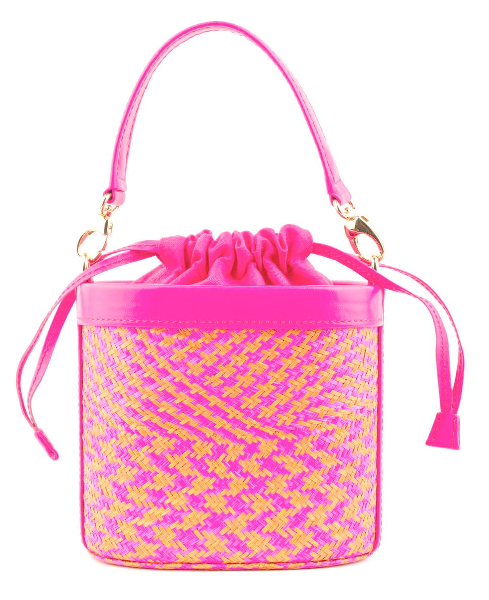 FOR 2026, GustokoLISBOA presents the Alix bag in a vivid fuchsia statement that pairs handwoven buntal texture from a small community of weavers in Pampanga with sleek leather trim finished with a soft drawstring and dual straps. Dimensions arw 17 x 18 x 8 cm