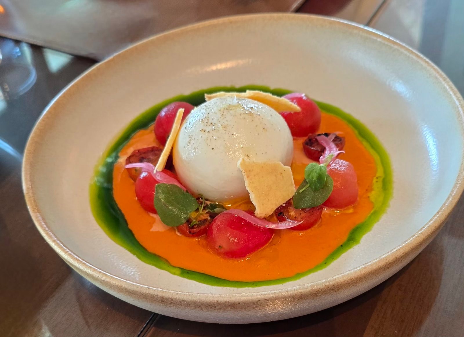 BURRATE with roasted tomatoes gazpacho and parmesan sable.